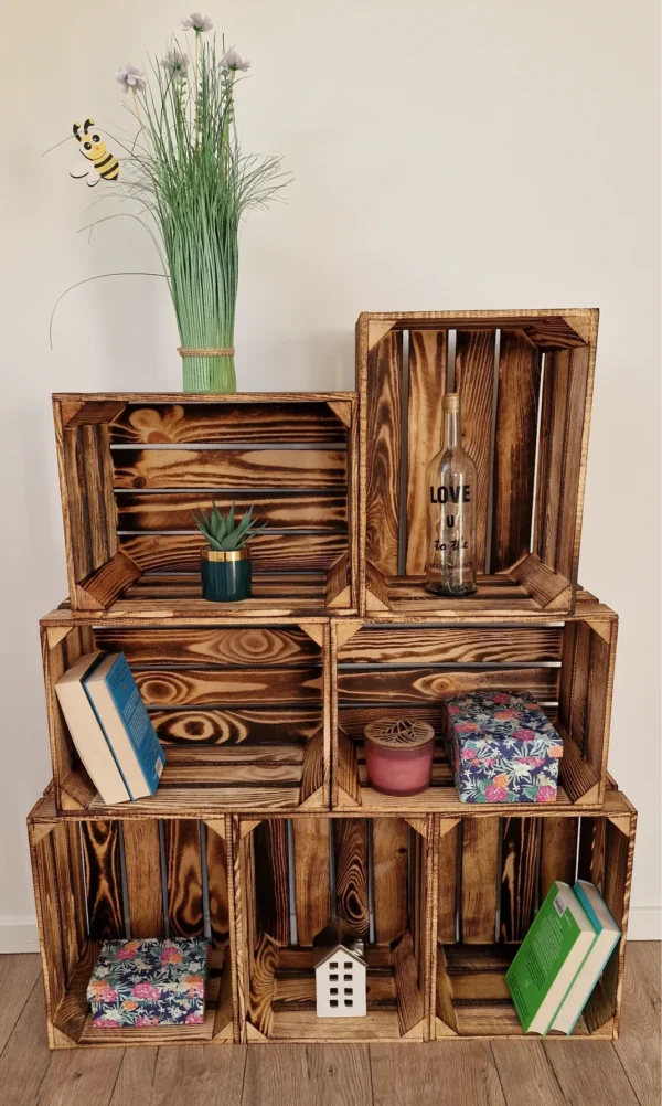 Burnt wooden crates used as decorative shelf