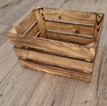 Burnt wooden crate on wooden floor